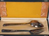 a box with a spoon, fork, and spoon in it