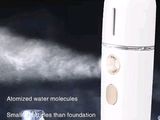 an image of a close up of a bottle of water with a steam coming out of it