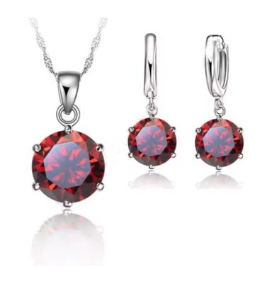 Parure, pendentif et paire de boucle d'oreille zircon teinte…