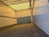 an image of the inside of a truck with the door open