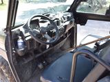 a close up of the steering wheel and dashboard of a utility vehicle
