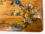 two birds sitting on a branch of a tree with flowers