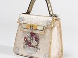 an image of a handbag with a crown on it