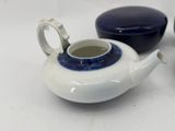 three teapots sitting next to each other on a table