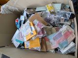 a cardboard box filled with many different types of items