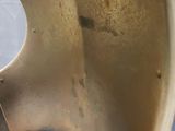 a close up of a metal object with a hole in it