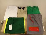 three men ' s shirts and pants are laid out on a table