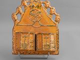 an image of a small wooden box with a design on it