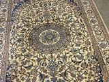 an image of a large oriental rug on the floor in a room