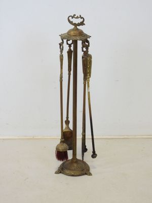 an image of a set of three metal tools sitting on top of a white floor