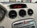 a car dashboard with a clock and air vents in it