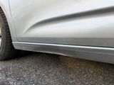 a close up of a car ' s tire on the road