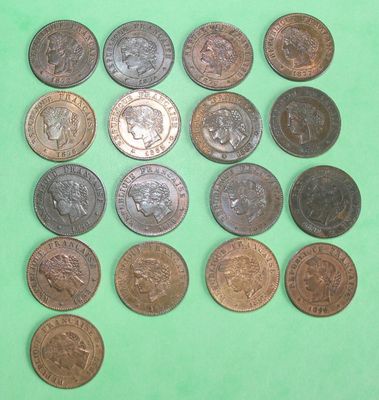a lot of coins that are on a green surface