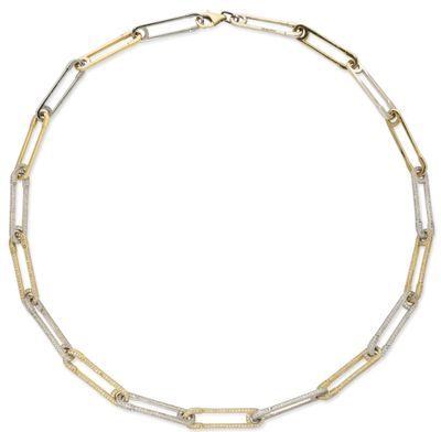 a gold and silver necklace on a white background