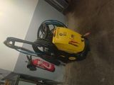 a yellow machine that is sitting on the floor
