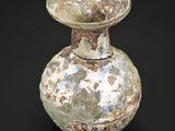 a vase that is sitting on a black surface