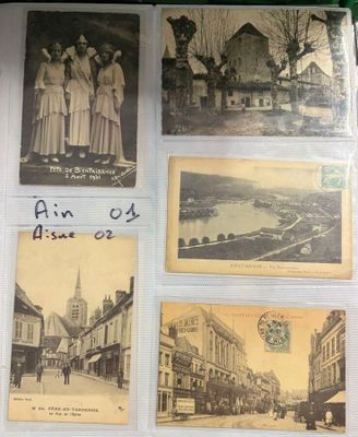 several old postcards of women in dresses are displayed on a table