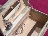 a small suitcase with a pair of scissors inside of it