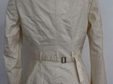 the back of a woman ' s jacket on a mannequin mannequin mannequin mannequin mannequin mannequin mannequin mann