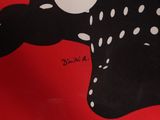 red shirt with black and white polka dots and a black cat on it