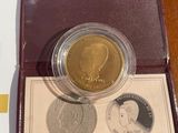 a gold coin with a picture of a woman on it