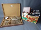 a box of silverware and a box of silverware