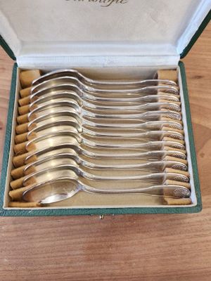 a lot of spoons in a box on the table