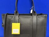 a black leather handbag with a yellow tag on it