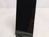 a close up of a cell phone on a table with a white background
