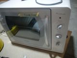a white microwave oven sitting on a counter top
