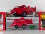 three toy vehicles that are sitting on a table