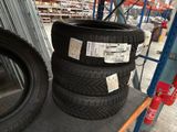 two tires are stacked on top of each other in a warehouse