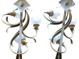 pair of metal sconces with flowers and a bird on them