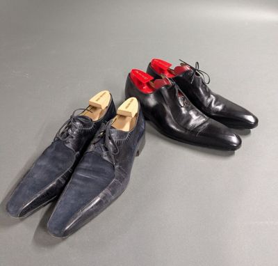 two pairs of shoes sitting on top of a table