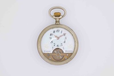 a gold pocket watch with a white face on it