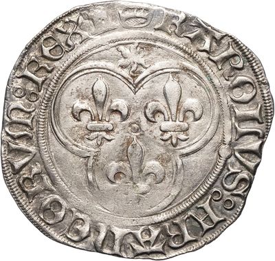 une pièce d'argent dont le revers est orné de fleurs