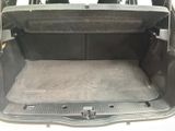a trunk of a car with the back seats folded down