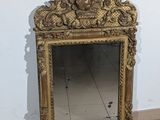 a mirror that is sitting on the floor in front of a wall