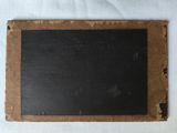 a blackboard on a piece of paper on a table