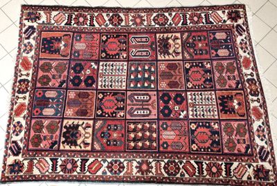 a close up of a rug on a tiled floor