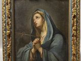 un tableau représentant une femme tenant une pipe à la main