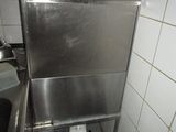 a stainless steel sink in a kitchen with a trash can