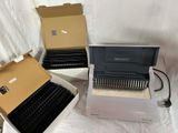 three boxes with different typewriters in them on a white surface