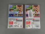 a close up of two nintendo wii game cases on a table