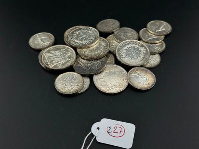 a pile of silver coins with a price tag on it