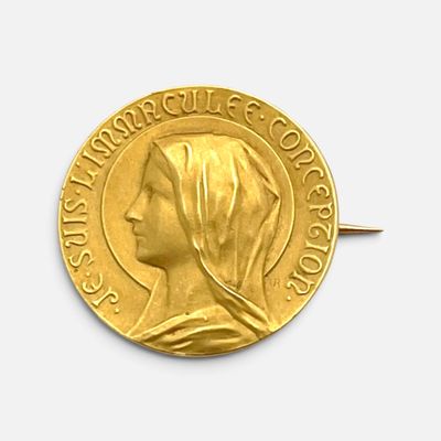 pièce en or jaune représentant le profil d'une femme