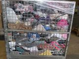 a metal cart with many items in it in a warehouse