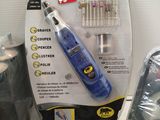 a blue and white electric toothbrush sitting on a counter