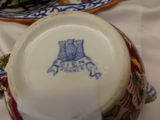 a close up of a cup and saucer on a table