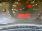 a close up of a car dashboard with a speedometer